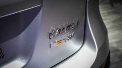 Надпись NFR под шильдиком на задней двери Lada Kalina NFR